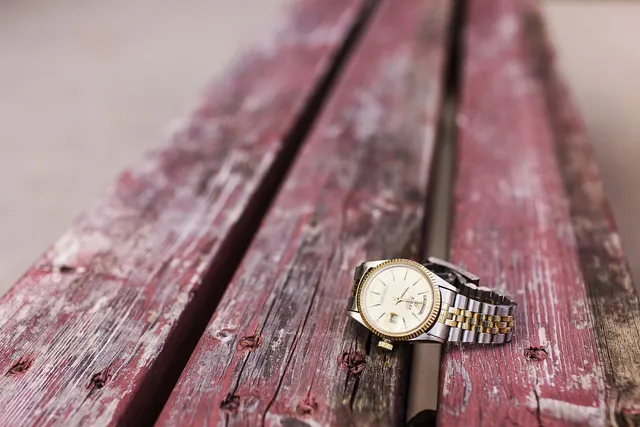 Minimalistic round gold watch with black strap made from recycled leather