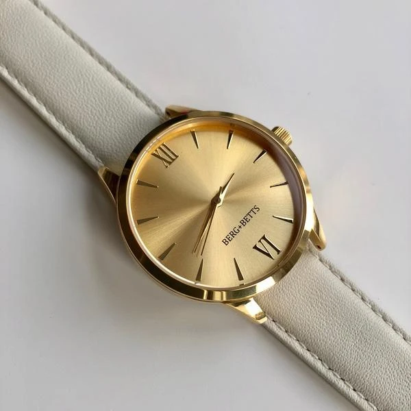 BERG+BETTS Mindful gold watch with mirrored face with sustainable ivory leather strap